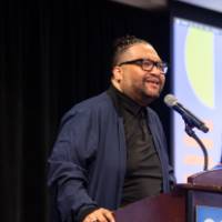 Dr. Shorty speaking at podium photo 3